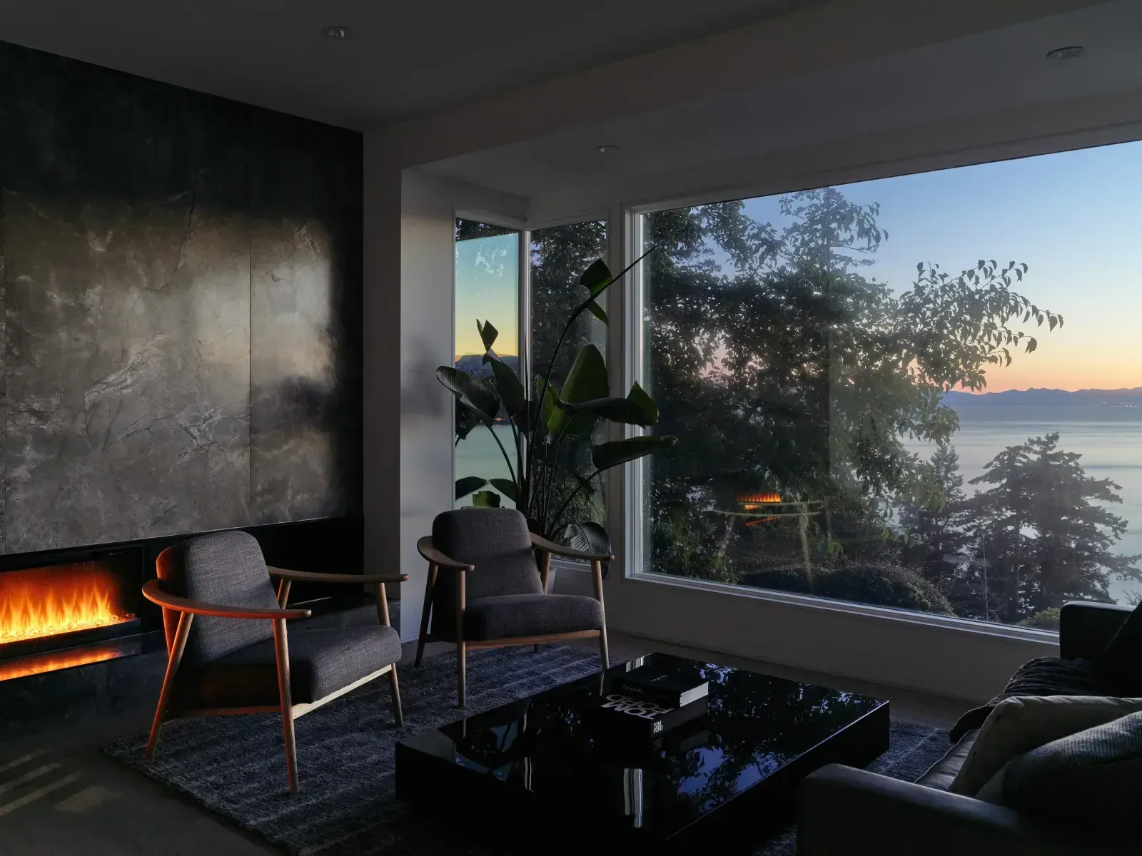 Living room fireplace lit at dusk